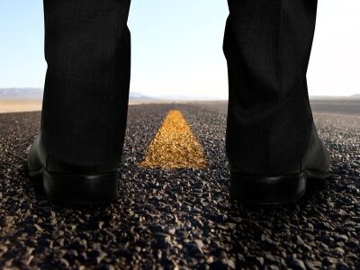 Man standing on the road thinking about a career change