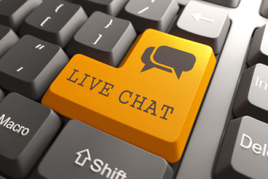 Orange Live Chat Button on Computer Keyboard. Internet Concept.