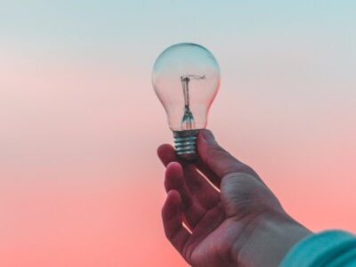 Entrepreneur with an Idea Aolding a Light Bulb