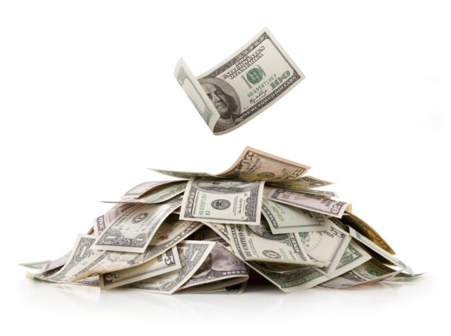 Heap of money. Dollar bills.