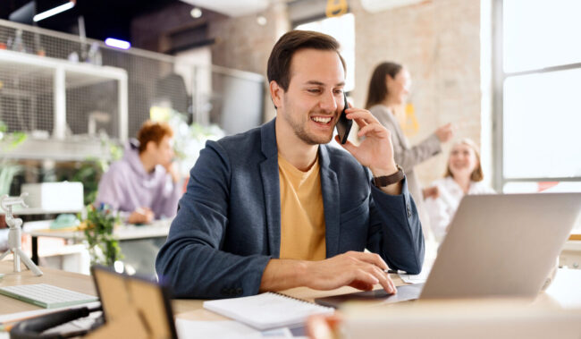 Happy man talking on the smartphone